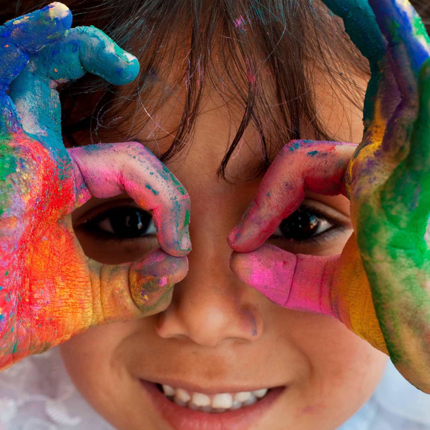 Baby boy with face painted colorfully