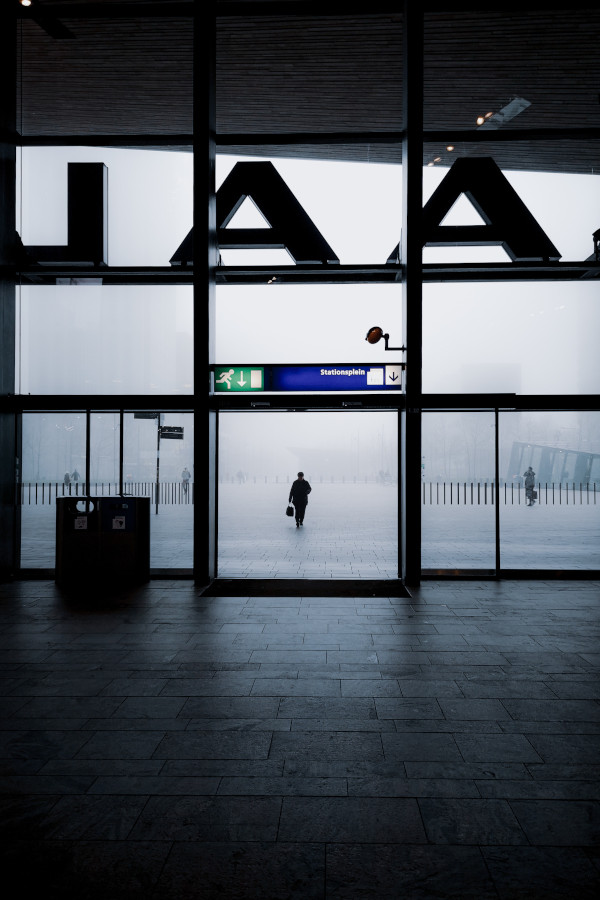 Peering outside covered with snow from the exit of Rotterdam station