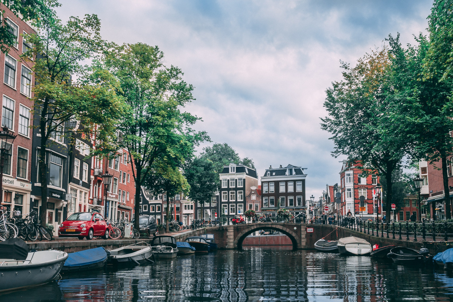 Town houses and a bridge seen from cannal in Amsterdam