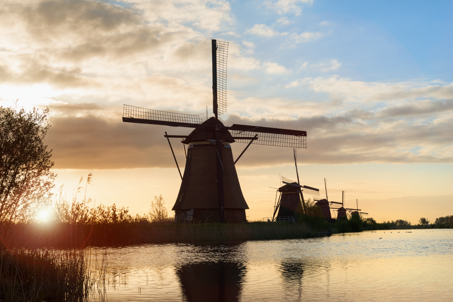 Water wheel house lit by sunset in the Netherlands